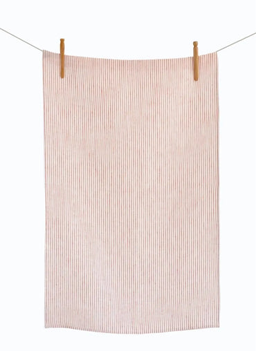 Striped towel hanging on a clothesline with wooden clips against a white background