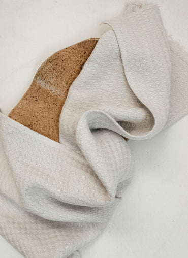 Hampton Linen Tea Towel draped over a loaf of fresh bread