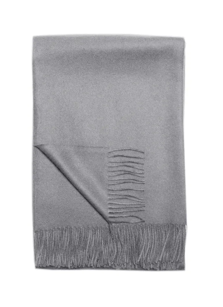 Light gray Paris Baby Alpaca Throw folded neatly with fringe details