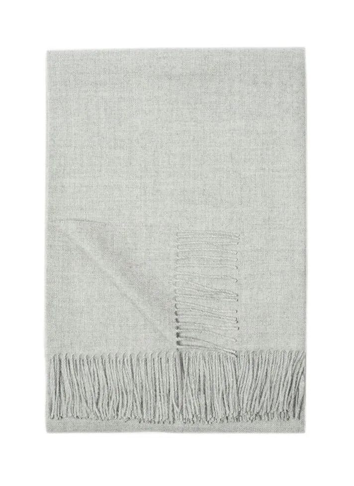 Paris Baby Alpaca Throw in light gray with delicate fringe, displayed hanging against a white background